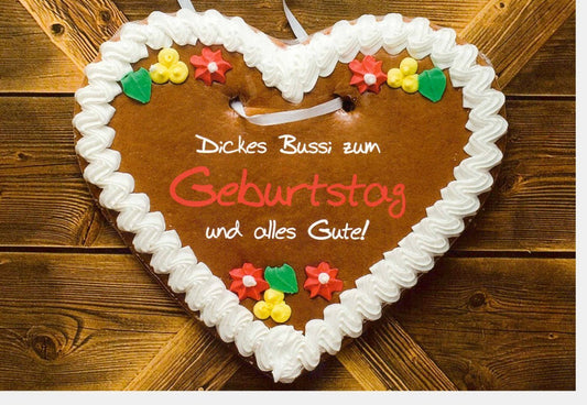 Geburtstagskarte für Partner: Romantische Herzform mit Lebkuchenmotiv und süßer Schokoladenverzierung, voller Liebe und festlicher Tradition.