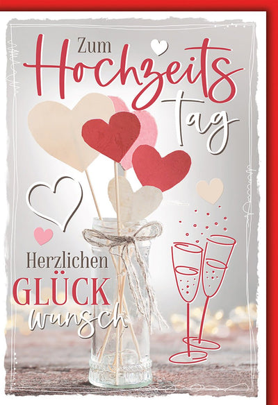 Hochzeitskarte Romantisch – Herzblumen im Glas mit Sektgläsern und handgeschriebenem Stil