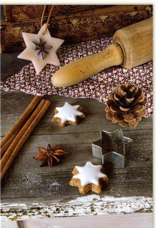 Traditionelle Weihnachtskarte "Merry Christmas" - Festliche Motive mit Sternen, Zimt und Tannenzapfen für winterliche Freude