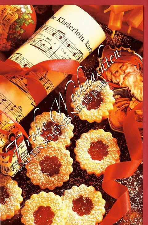 Festliche Weihnachtsgrußkarte mit Musiknoten und Gebäck - Motiv