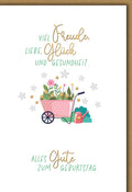 Geburtstagskarte Blumen – Bunte Schubkarre mit Gartenblumen und handgeschriebenem Text