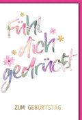 Geburtstagskarte Frauen – Bunte Aquarell-Schrift mit Blumen und Goldakzenten