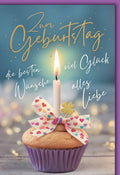 Geburtstagskarte Frauen – Cupcake mit Herzchen-Schleife und leuchtender Kerze