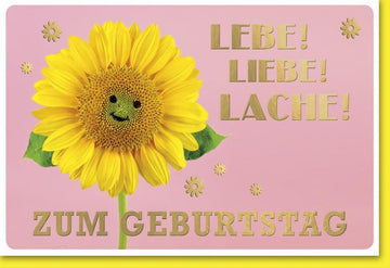 Geburtstagskarte mit Sonnenblume und goldenem "Lebe Liebe Lache" Schriftzug auf rosa Hintergrund