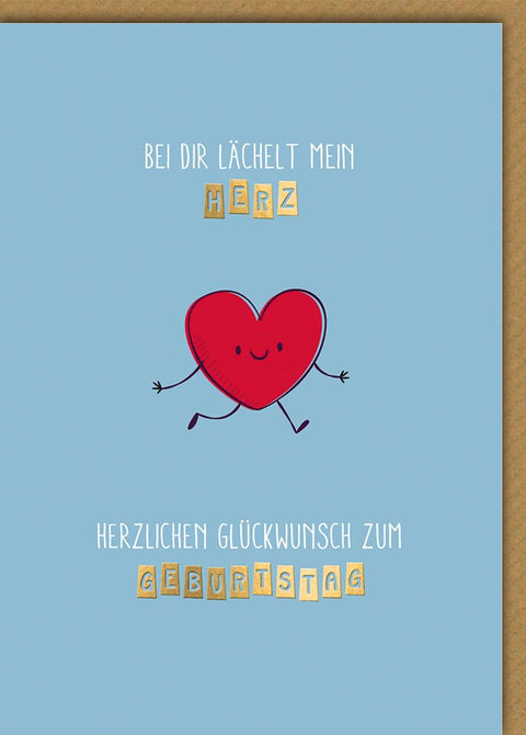 Geburtstagskarte Partner – Herz mit Lächeln und verspieltem Schriftzug auf Blau