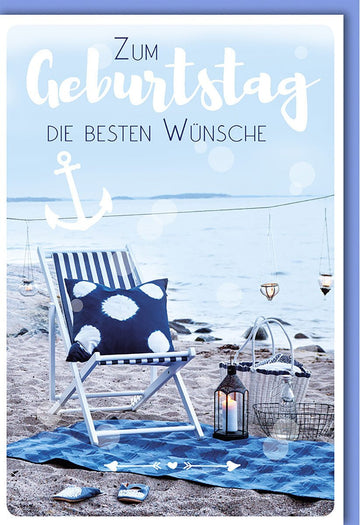 Glückwunschkarte Geburtstag mit Strandmotiv: Anker, Liegestuhl und Kerzen im Hintergrund
