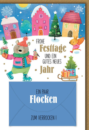 Weihnachtskarte Kinder – Bär und Fuchs im Winterdorf mit Schneeflocken und Humor