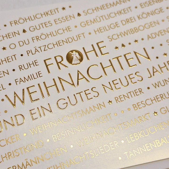 Weihnachtskarte mit festlichem Schriftzug und goldenen Sternen für frohe Feiertage