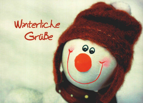 Winterliche Postkarte mit Spruch Winterliche Grüße fröhlicher Schneemann rote Mütze lustige Postkarten Sprüche für die kalte Jahreszeit